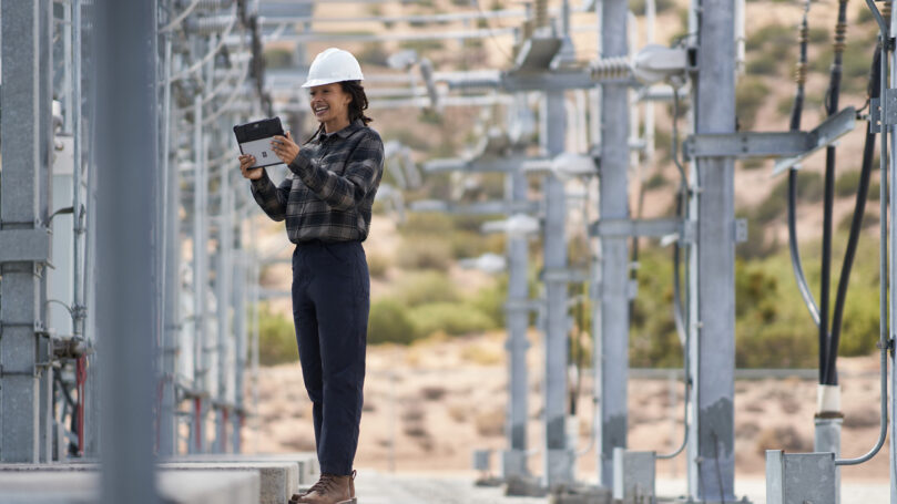An energy worker working outside