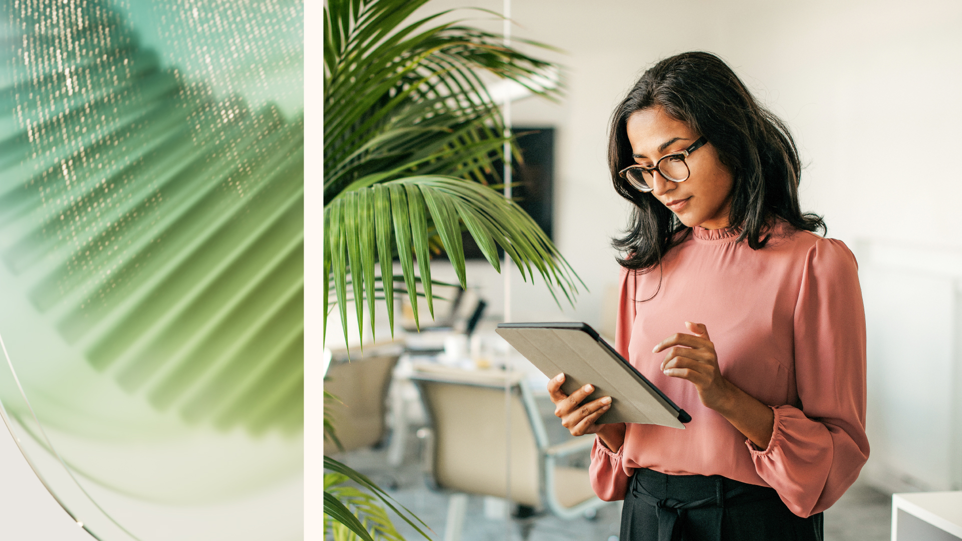 business woman in an office reading her tablet