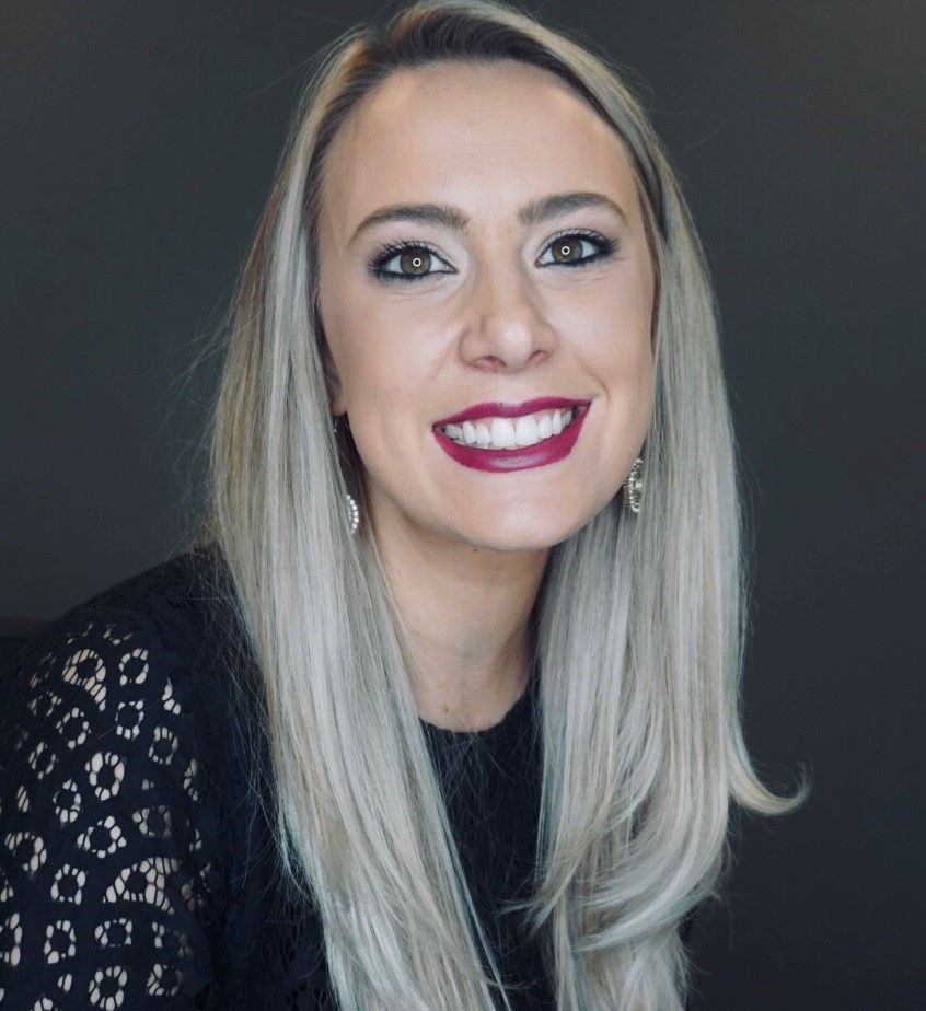 A woman smiling at camera