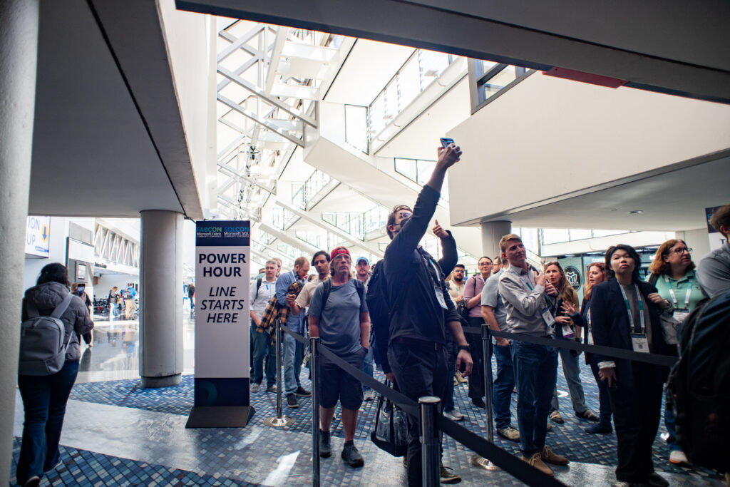 Attendee taking selfie while in the Power Hour line.