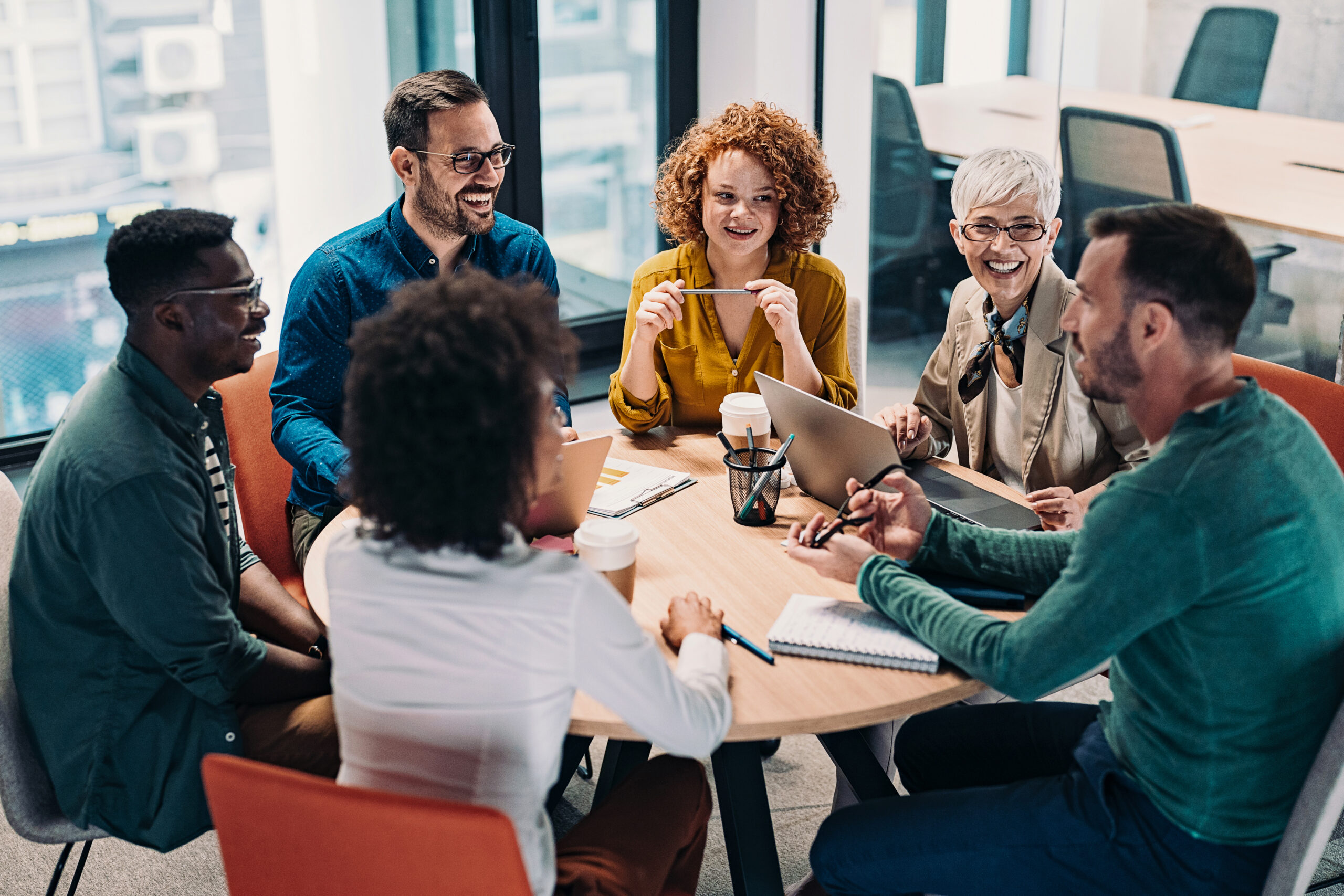 A group of people sitting around a table