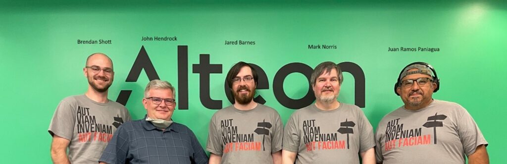 a group of men posing for a photo