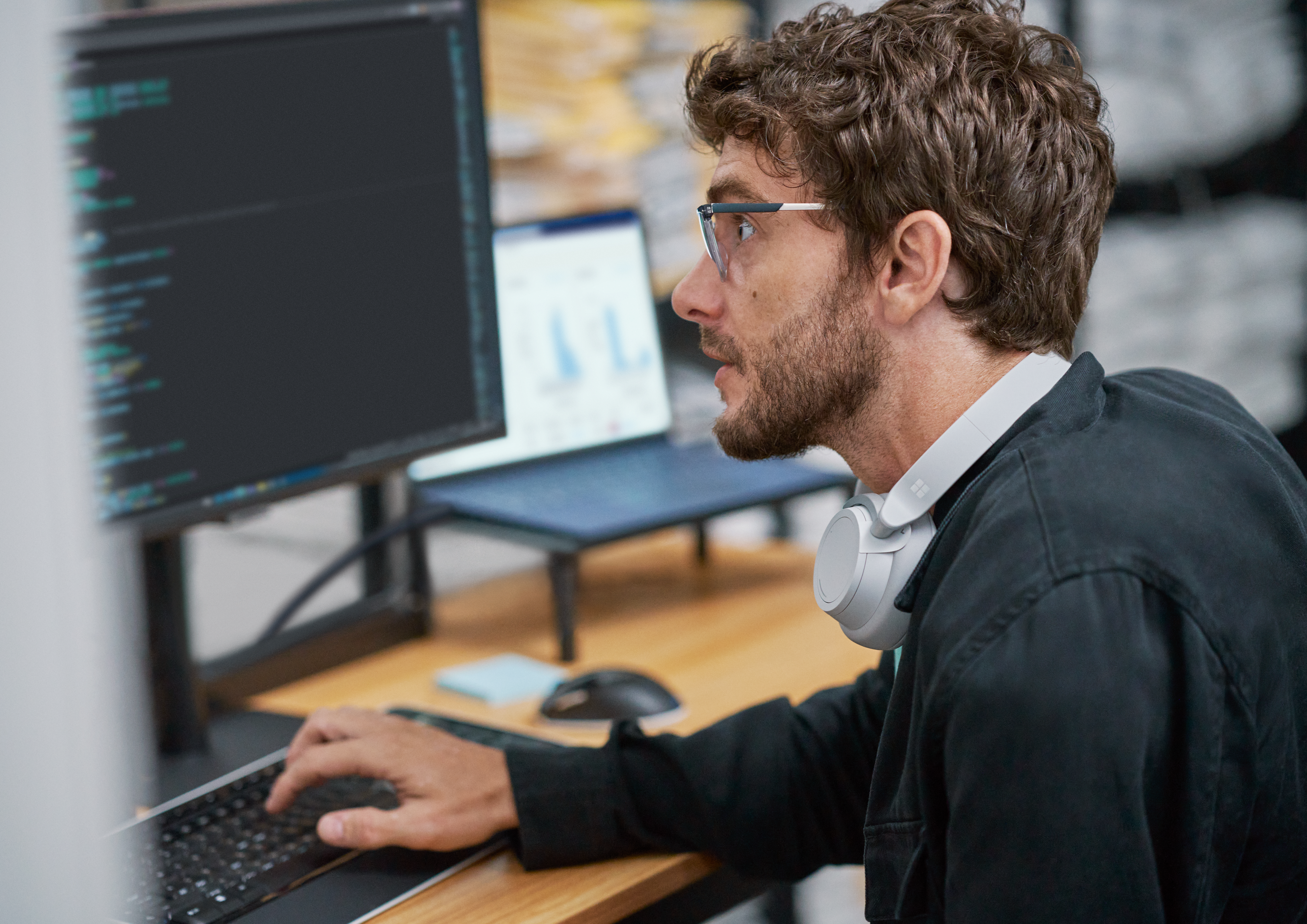 A man looking at a computer screen