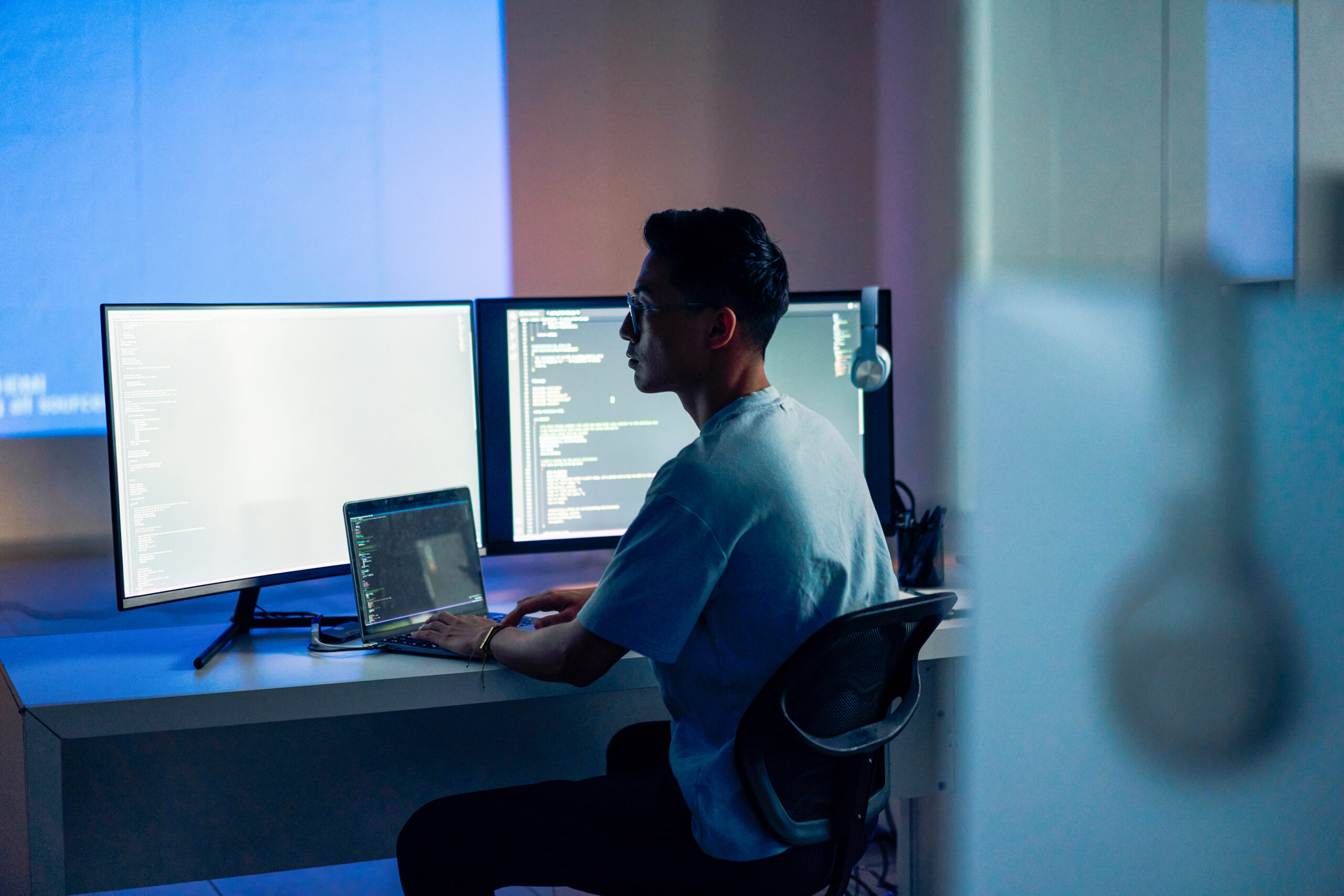 A man sitting at a desk with a computer