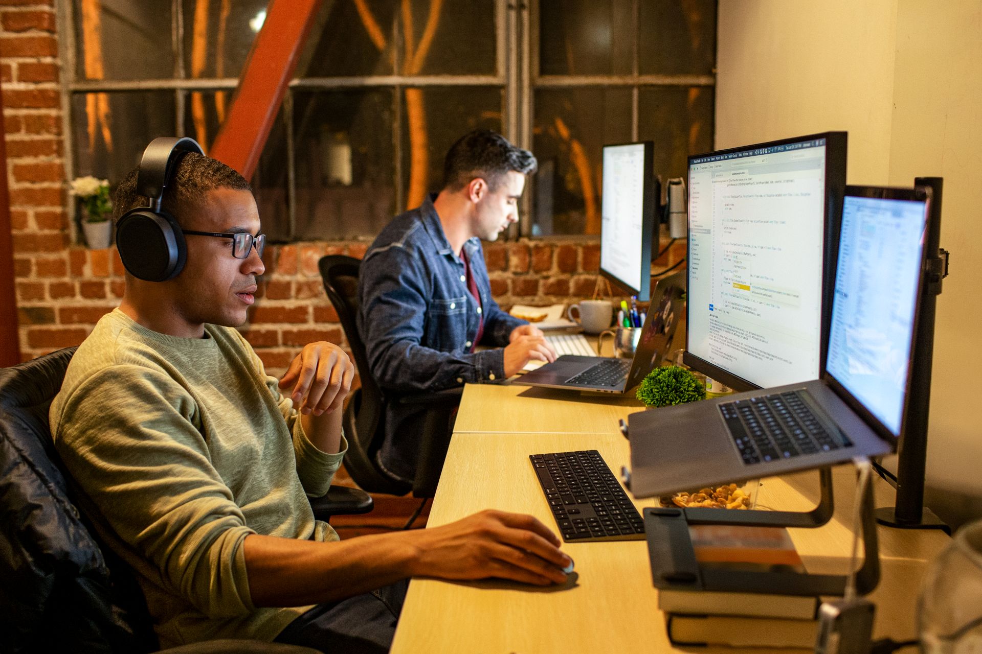 two people sitting at the computer