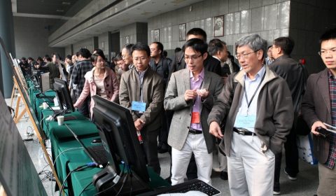 a group of people standing around a bag of luggage