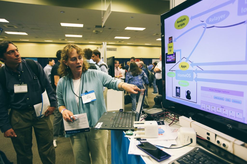 a person standing in front of a computer
