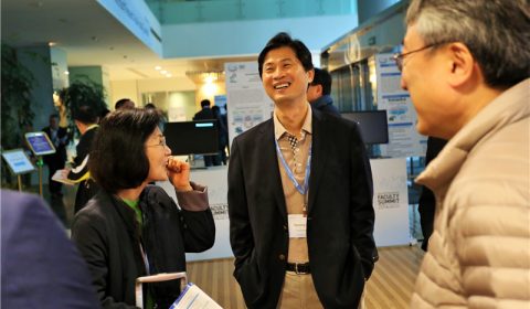 a group of people standing in a room