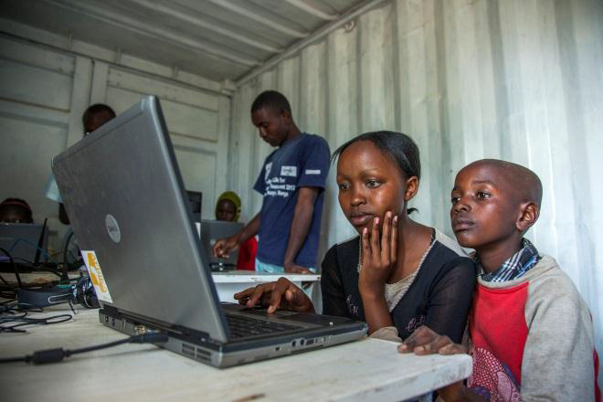 Students conduct research at the Mawingu White Spaces Broadband pilot container. (Photo credit: Georgina Goodwin)