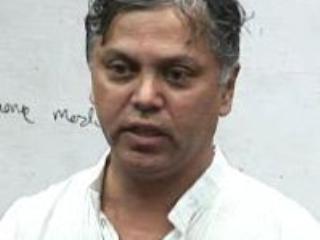 a man smiling for the camera