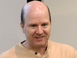 a man smiling for the camera