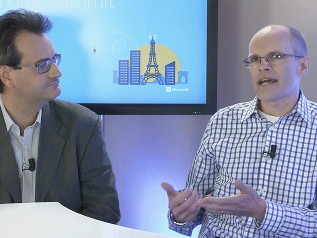 a person standing in front of a screen