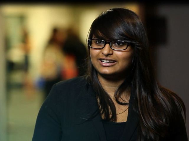 a person in glasses looking at the camera