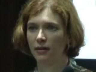 a woman looking at the camera