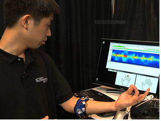 a man standing in front of a computer screen