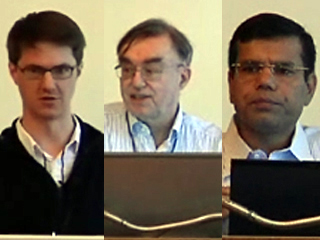 Geoffrey C. Fox et al. looking at a laptop