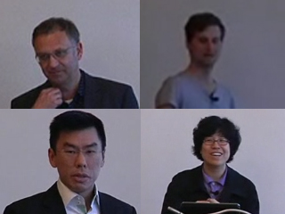 a group of people looking at a man in a suit and tie