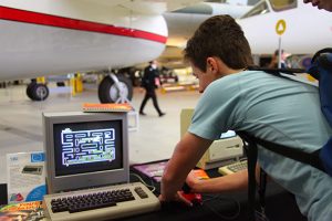a person standing in front of a computer