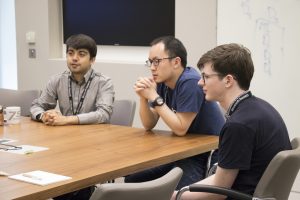 a group of people sitting at a table