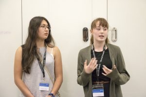 a person standing in front of a mirror posing for the camera