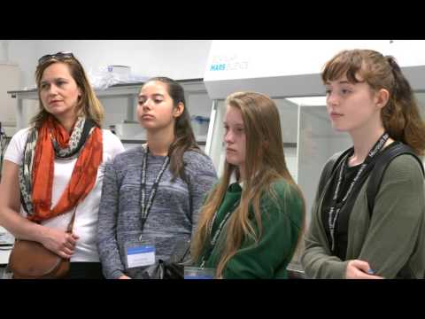 a group of people standing in a room