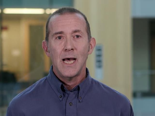 a man smiling for the camera