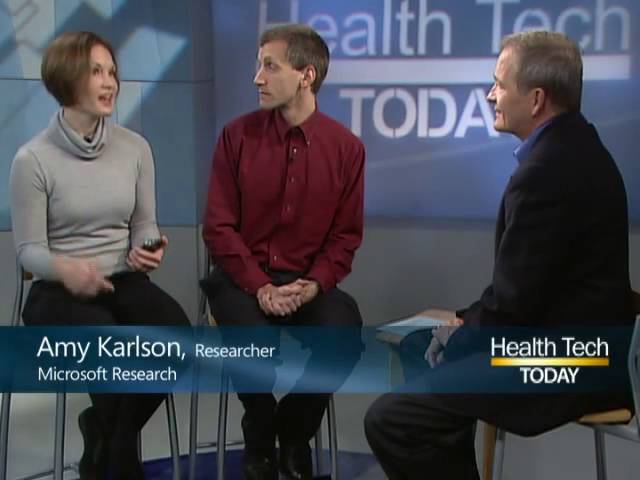 a group of people standing in front of a sign