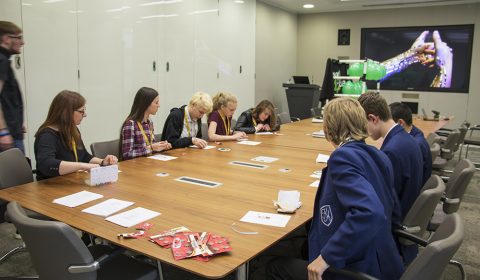 a group of people sitting at a table