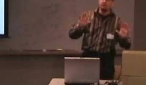 a man standing in front of a television