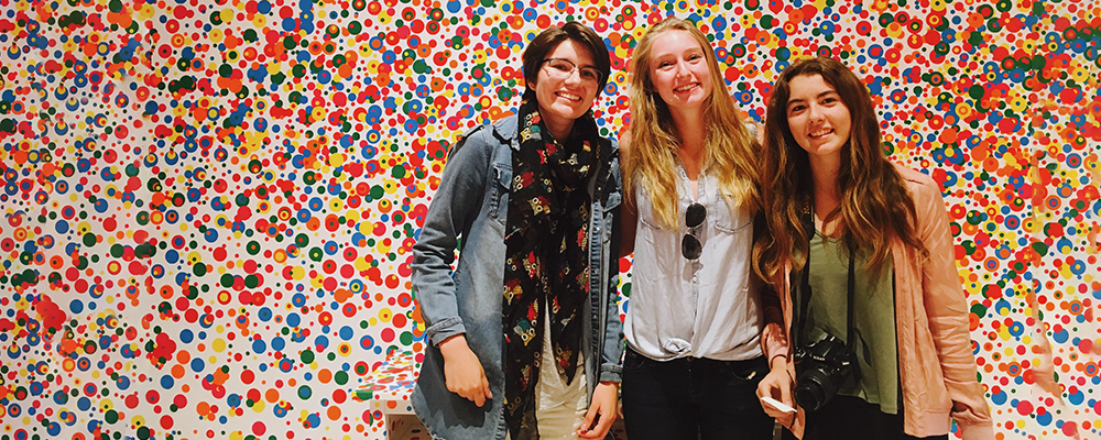 Delphine Lepeintre, Taylor Olson, and Josephine Passananti on a vibrant background