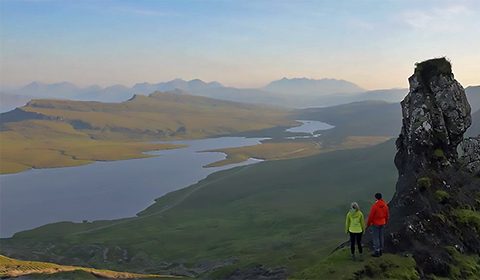 a man standing in front of a mountain