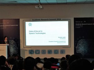 a group of people watching a screen