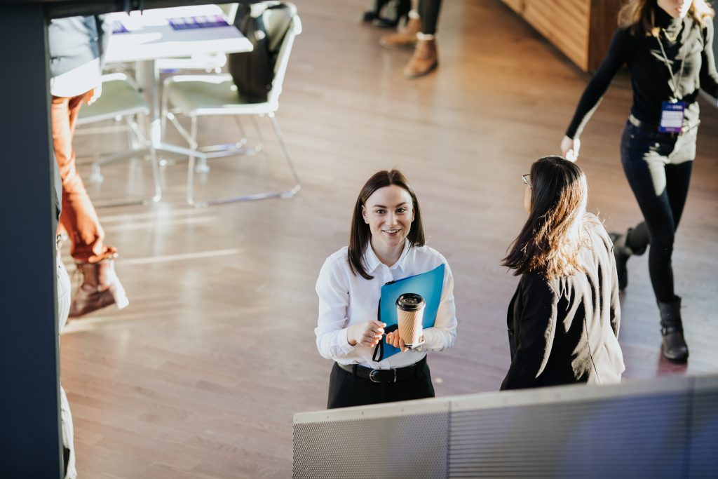 a group of people walking on the floor