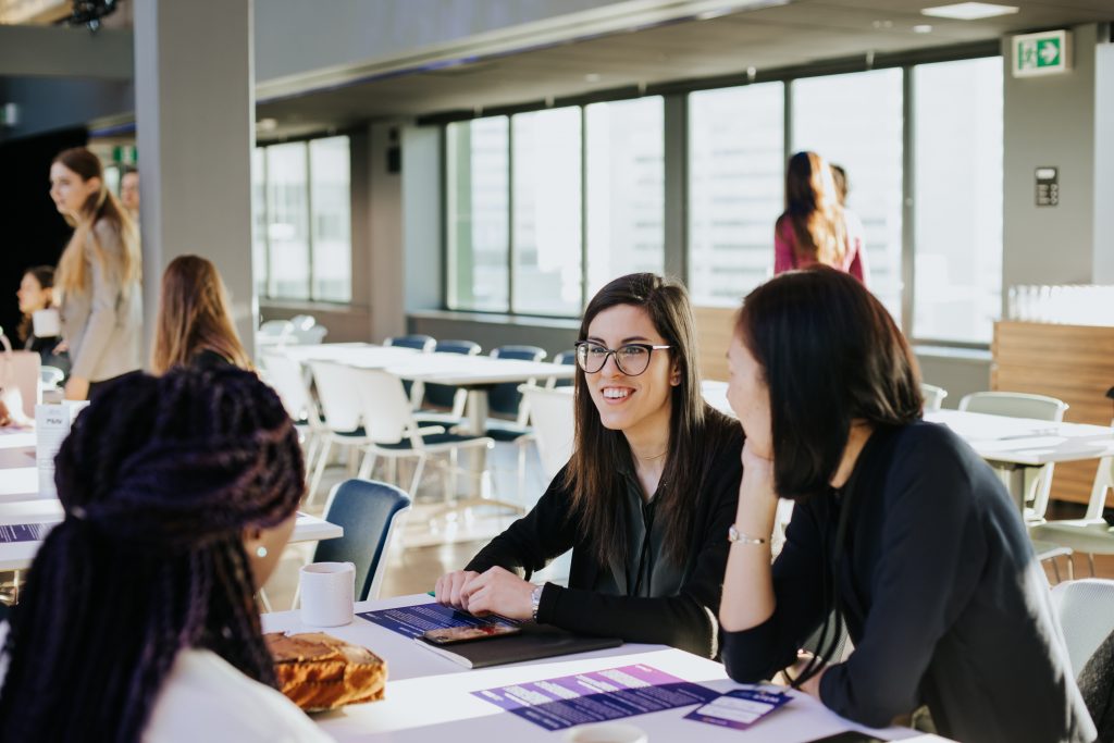 a group of people sitting at a table
