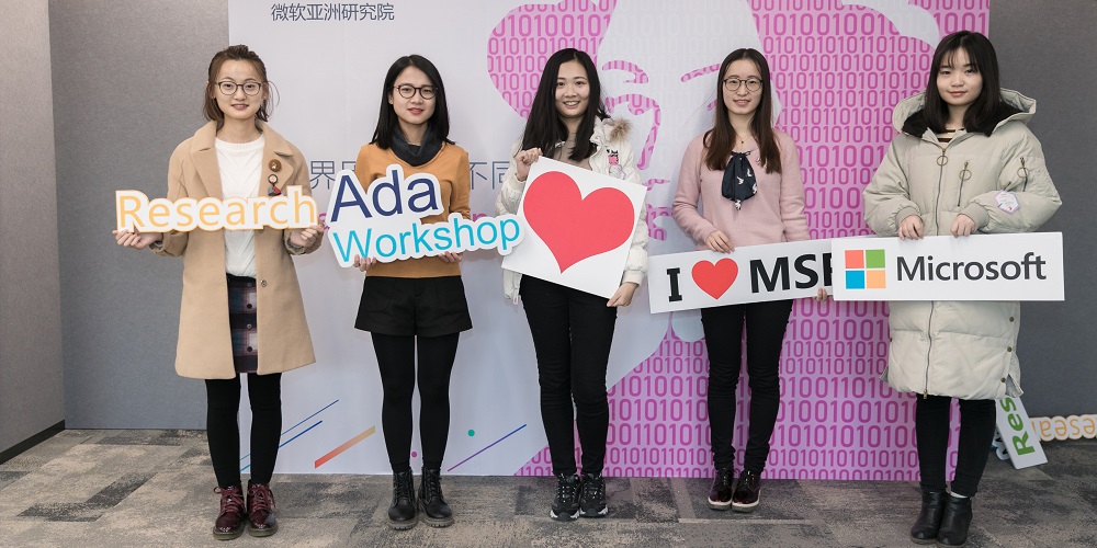 Ada workshop attendees took photos in front of the 