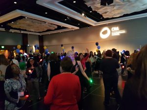 a group of people standing in front of a crowd