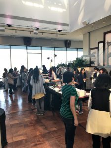 a group of people standing in front of a crowd