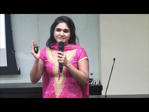 a woman standing in front of a mirror posing for the camera