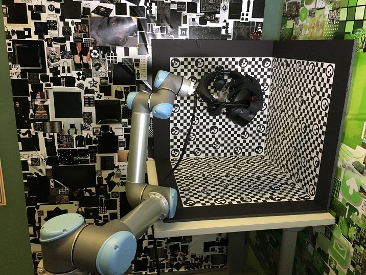 Calibrating this many headsets manually is unreasonably time consuming so we created a robotic camera calibration system to do it automatically (Fig. 8).