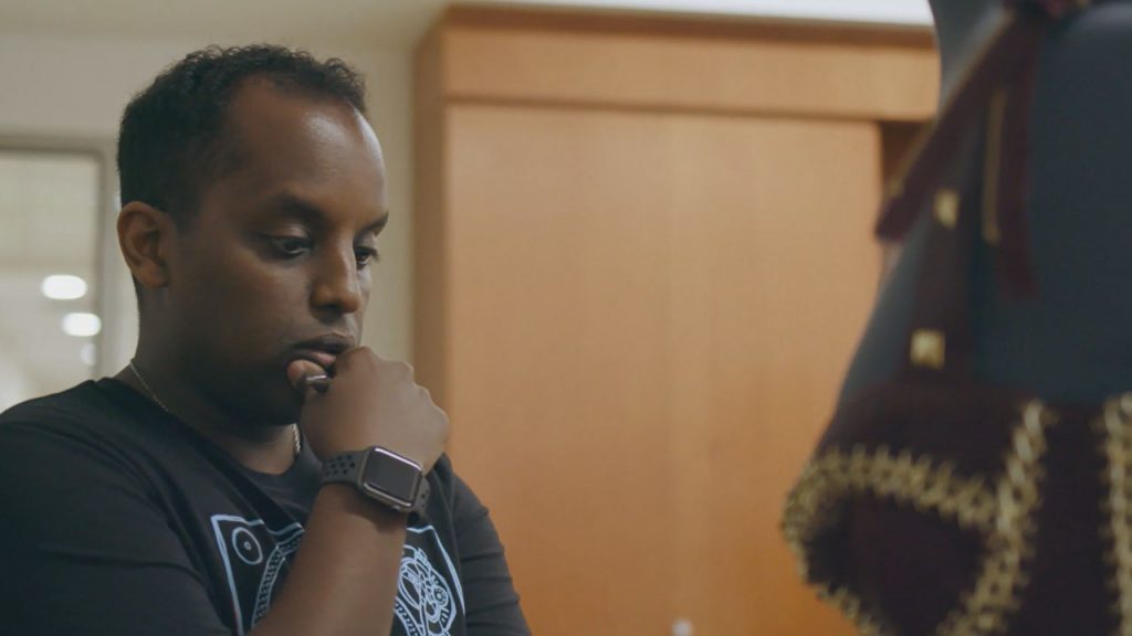 Research intern Teddy Seyed studies garment