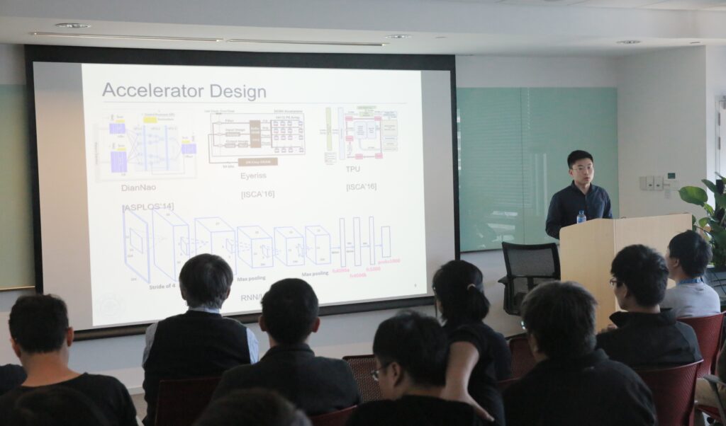 a group of people looking at a screen