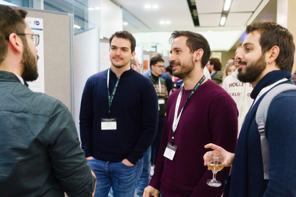 a group of people standing in a room