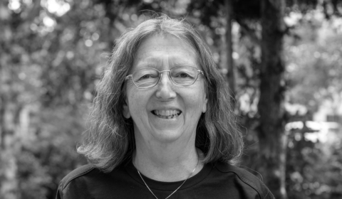 Susan Sumais wearing glasses and smiling at the camera