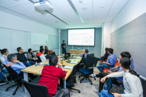 a group of people sitting at a desk