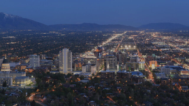 a view of a city with a mountain in the background