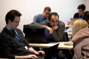 a group of people sitting at a table