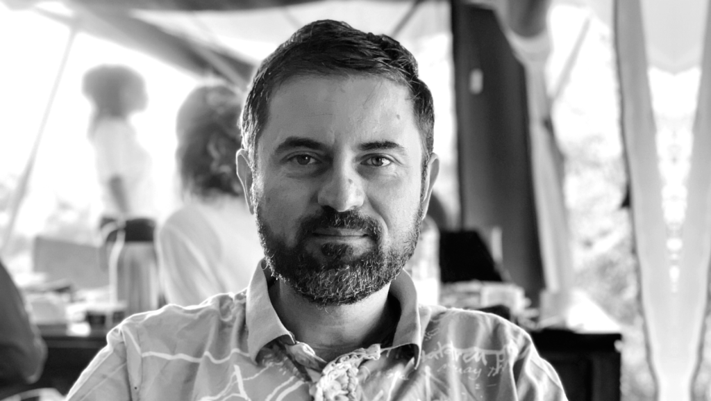 head shot of Dr. Stefan Saroiu for the Microsoft Research Podcast