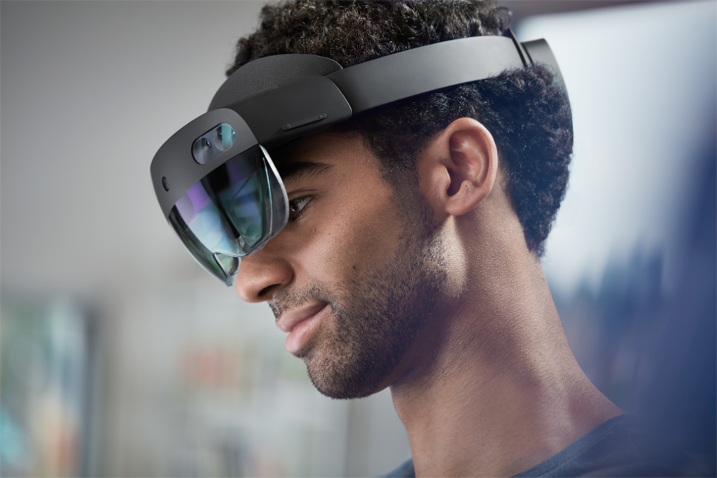 Lifestyle image of male wearing a Hololens 2 device 