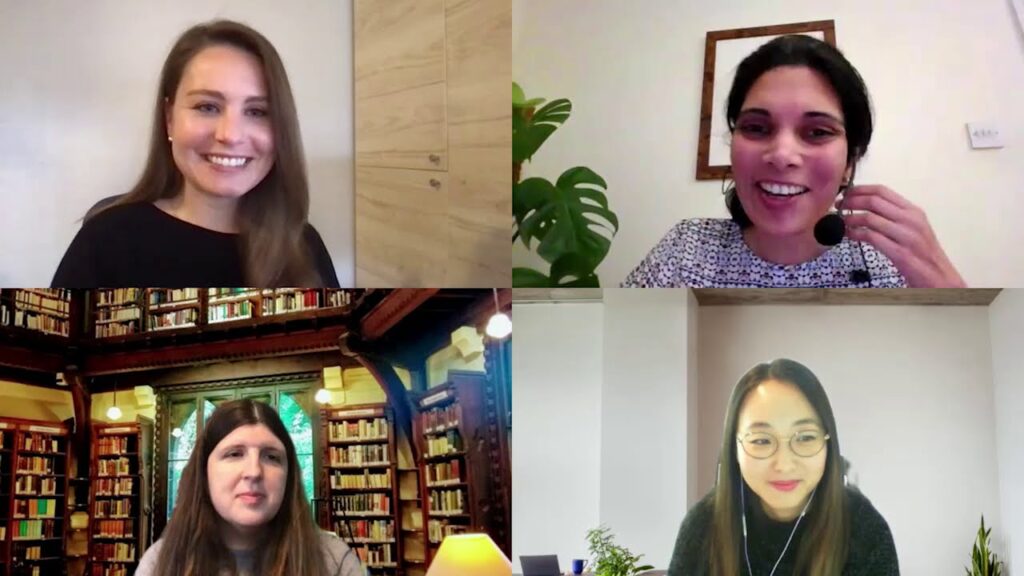 a woman posing for a photo in front of a store