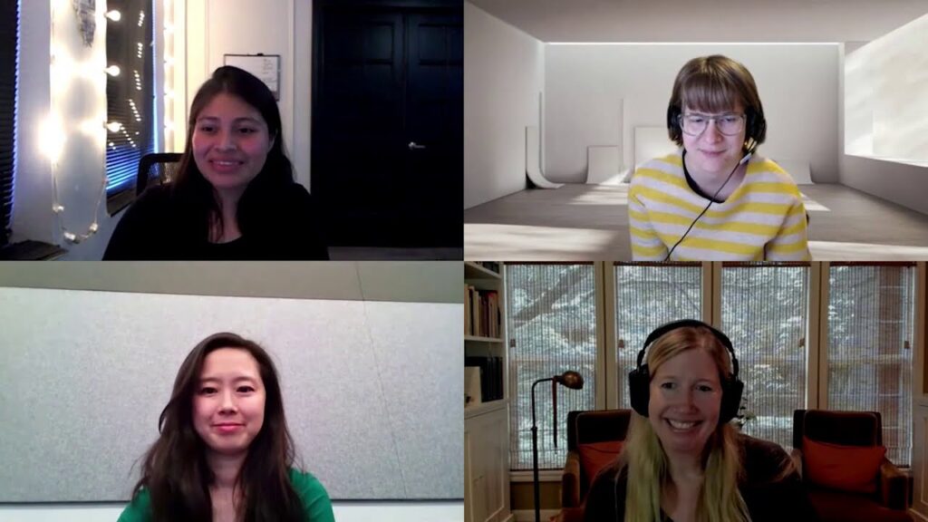 Haiyan Zhang standing in front of a window posing for the camera